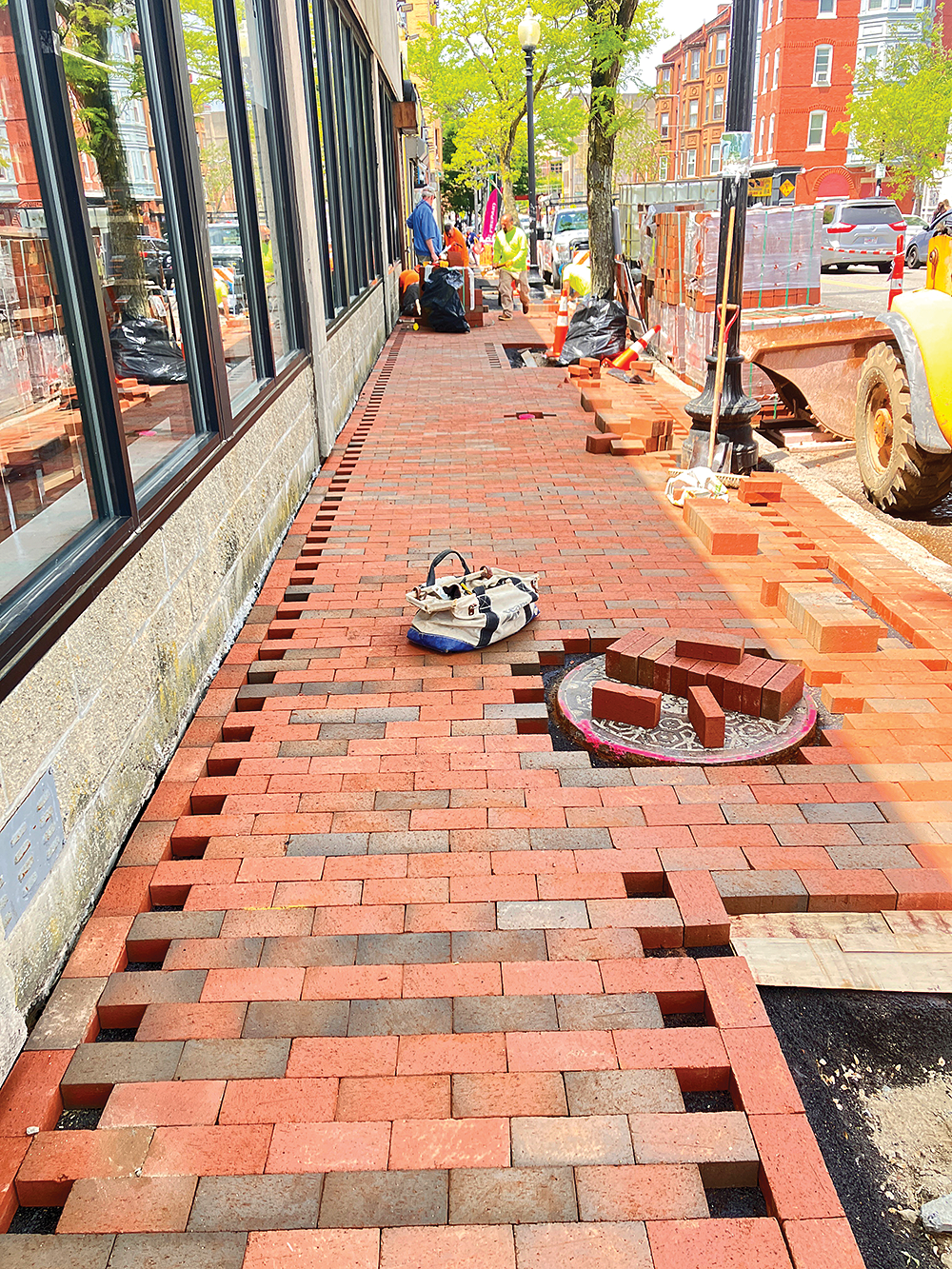 Through a collaboration of residents, businesses, and organizations in Uphams Corner, a long-called for project to retain and repair the brick sidewalks in the business district has begun. Photo courtesy City of Boston