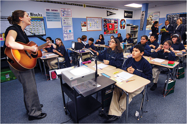 A classroom at Excel Academy in East Boston, taken during 2009 visit by Gov. Deval Patrick (among observers at back of the room). Chris Lovett photo