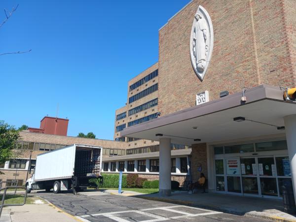 A moving truck was seen outside the main entrance of Carney Hospital last September, days after the hospital closed permanently. Seth Daniel photo