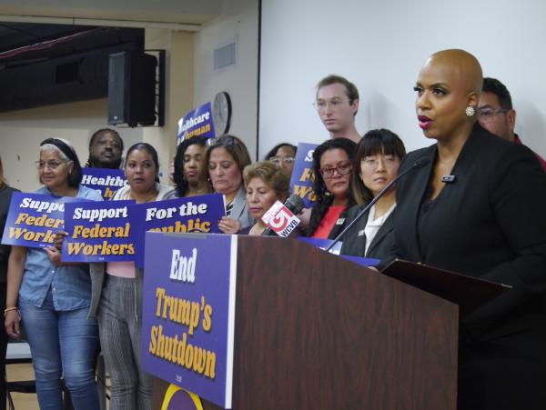 US Rep. Ayanna Pressley gathered with government workers and union representatives last Friday at the office of an SEIU Local on West Street in Boston to discuss the government shutdown. Yawu Miller photo